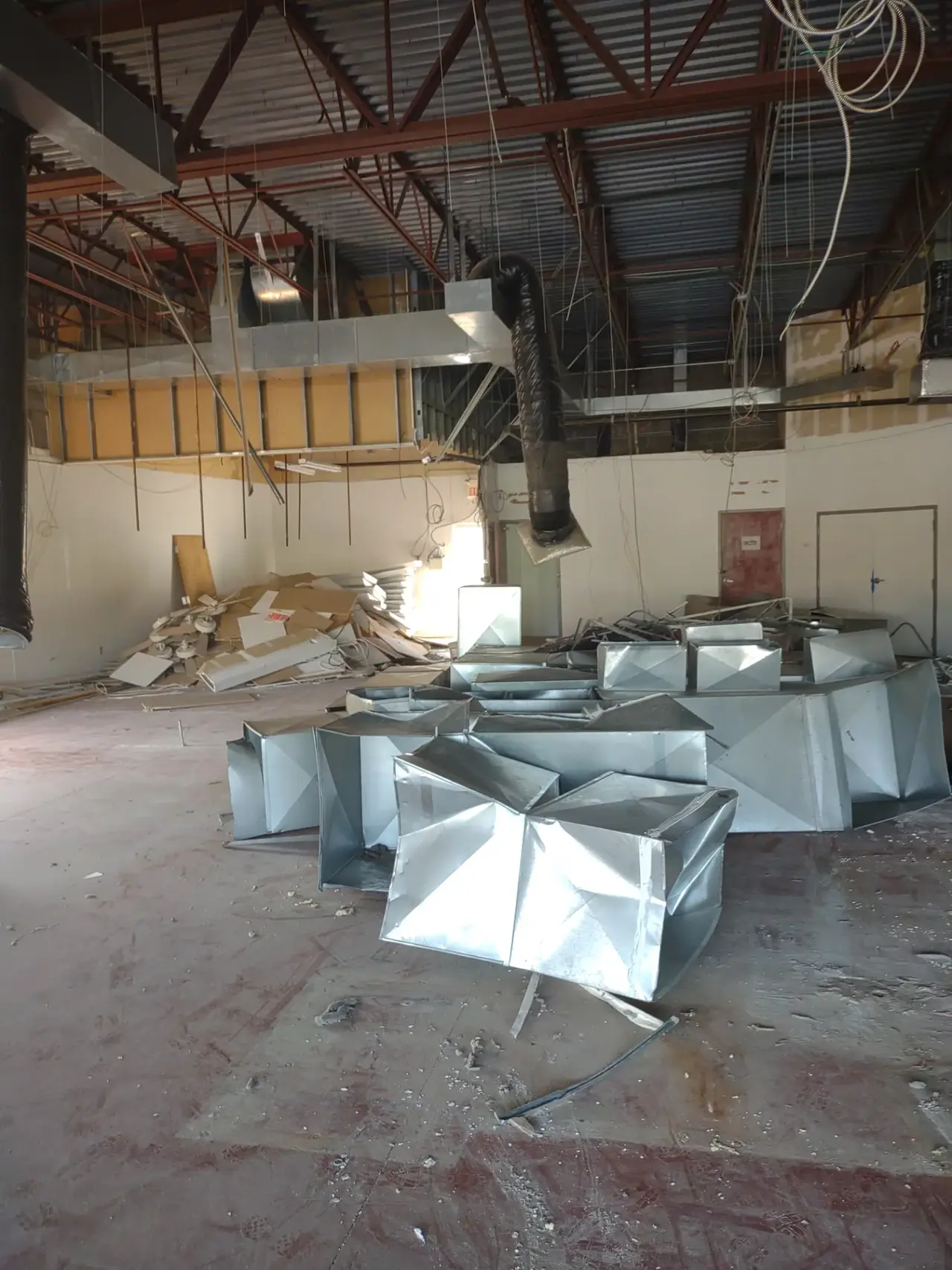 Commercial interior during demolition with removed ductwork