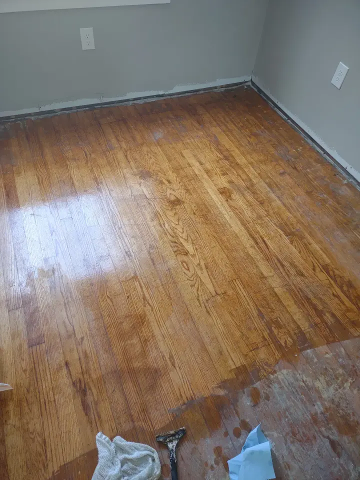 Floors, Tile & Drywall: Hardwood floor refinishing in progress