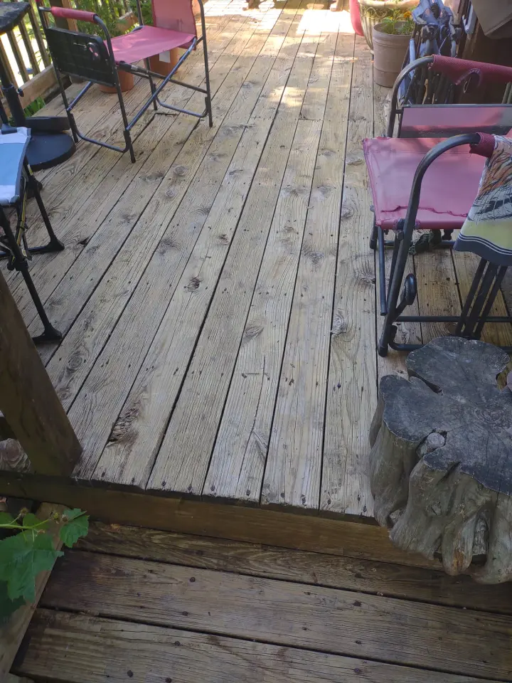 Exterior & Additional Details: Weathered deck boards before refinishing