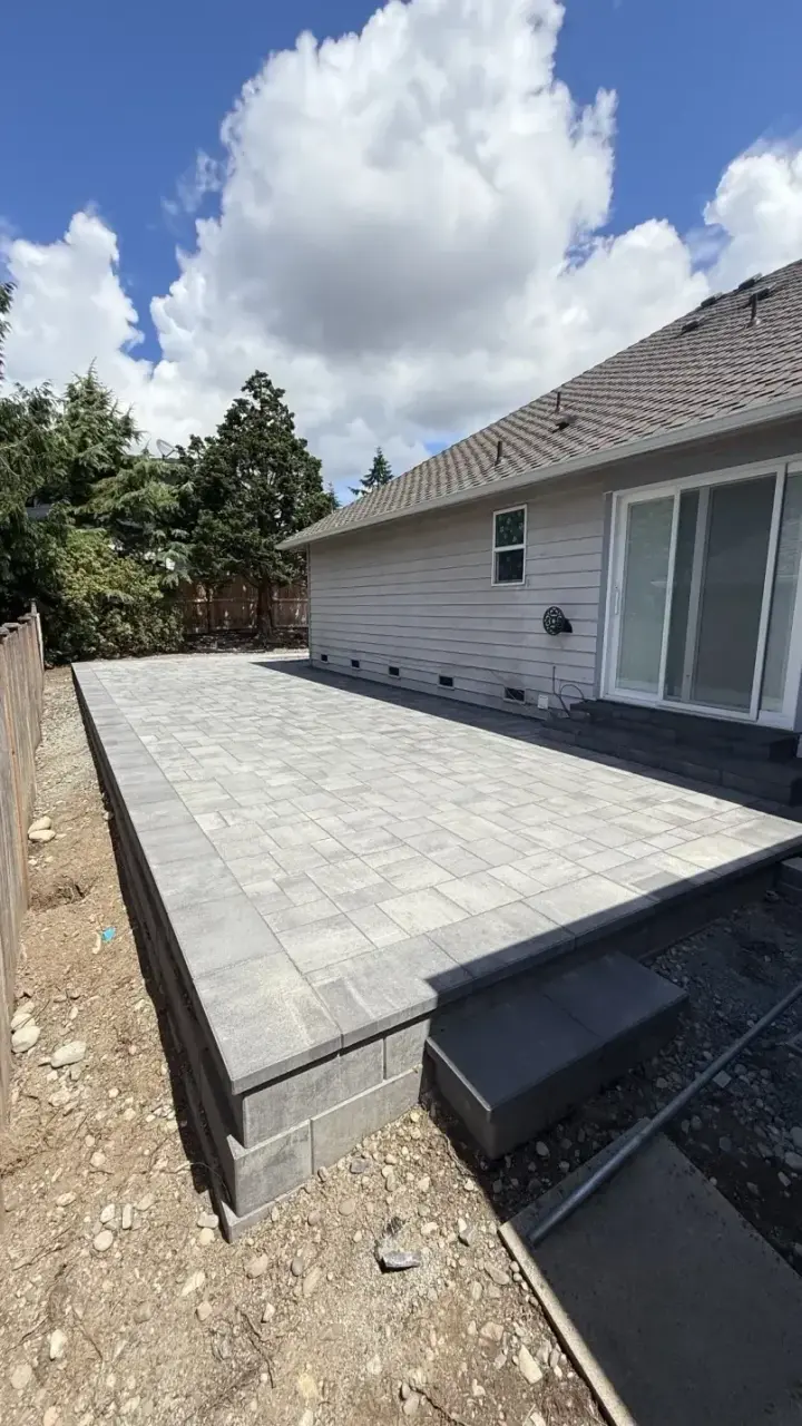 Outdoor Projects: Completed paver patio beside a home