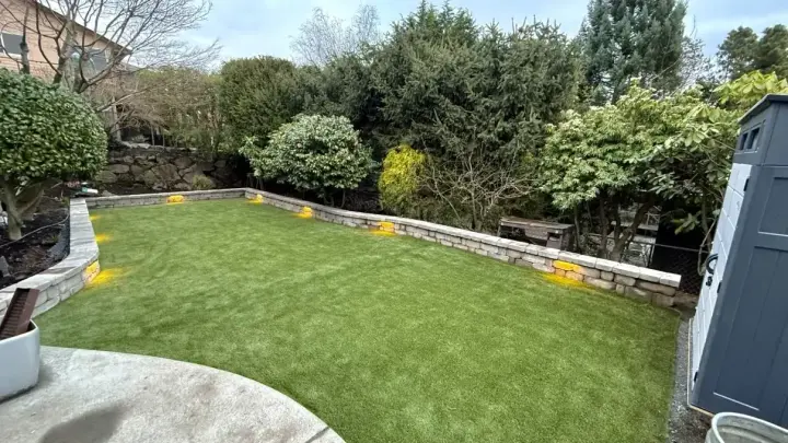 Outdoor Projects: Landscaped yard with turf and retaining wall